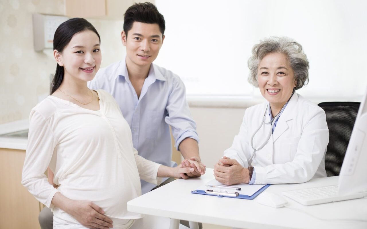 young-couple-receiving-antenatal-care-in-hospital-e1699525344137.jpg